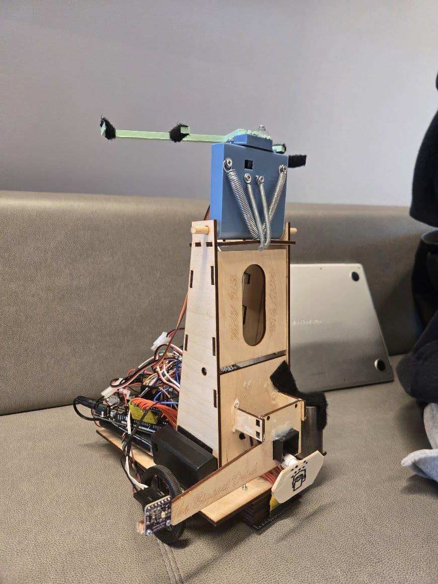 Front view of the autonomous bartending robot outside the course